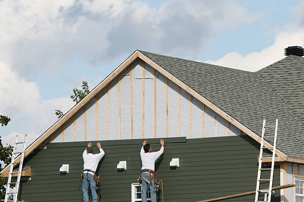Professional Siding technician working in Kittredge, CO